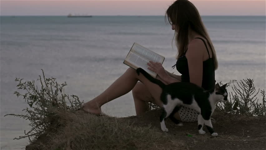 Reading a book on beach side
