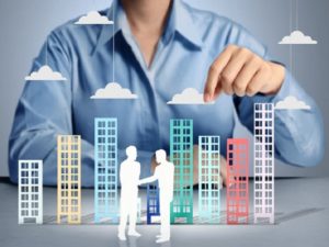 Building in hand businessmen