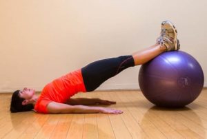 Glute bridges with stability ball