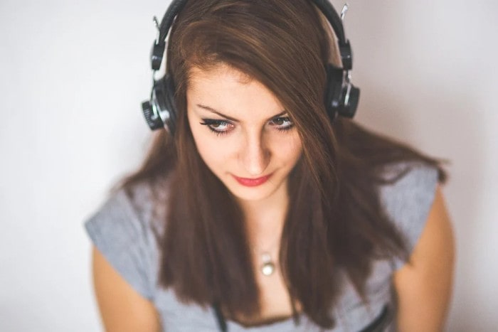 A woman wearing noise-cancelling headphones