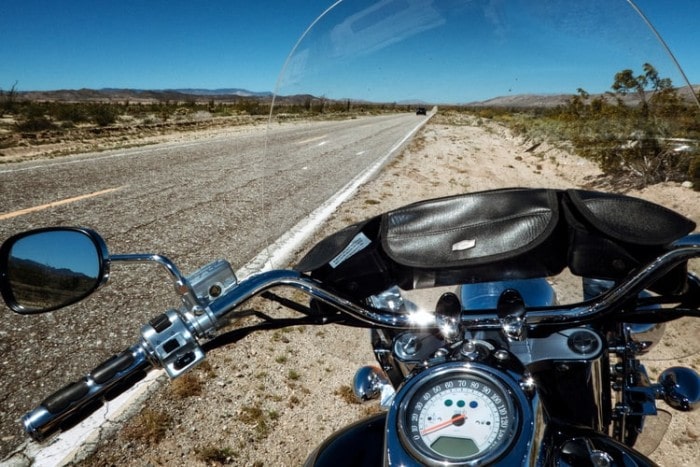 touring motorcycle beside a road