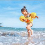 a little playing in the water at the beach