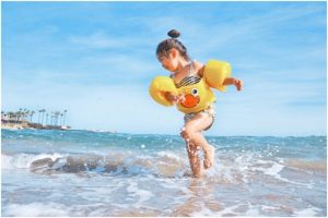 a little playing in the water at the beach