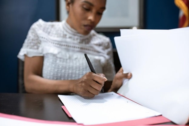 A woman preparing her résumé and cover letter