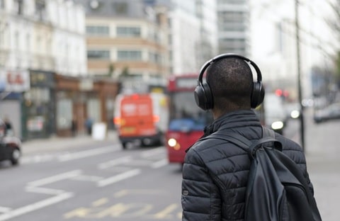 a person listening to audiobooks with headphones