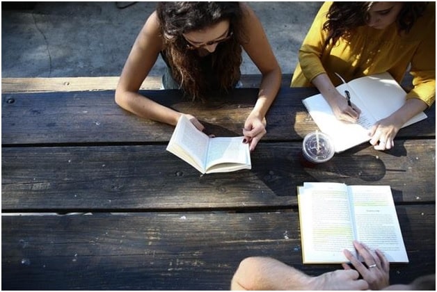 Students learn Hebrew at an outdoor bench